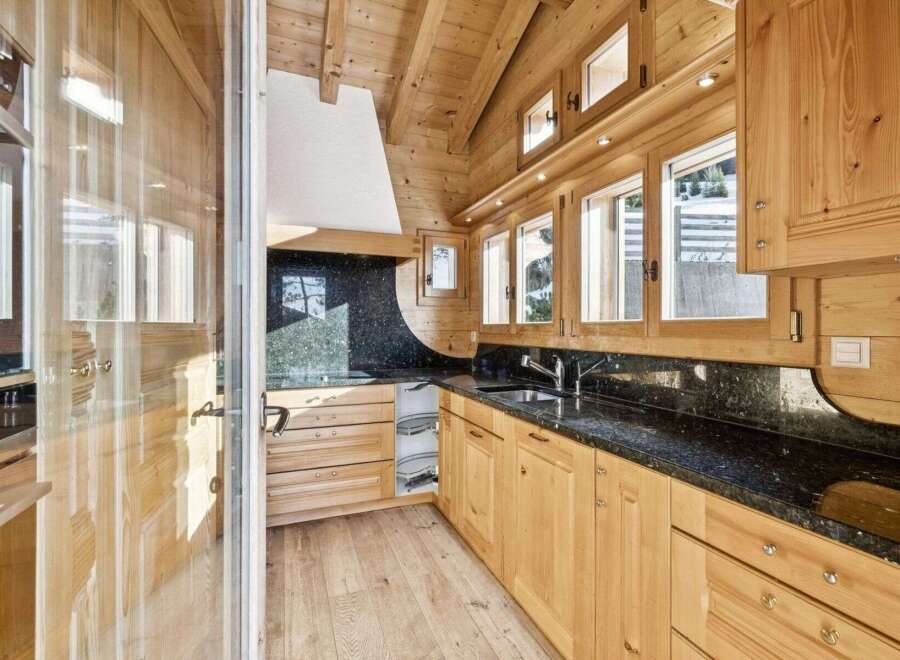 This stunning kitchen boasts a warm, inviting atmosphere with its natural wood cabinetry and flooring.