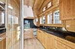 This stunning kitchen boasts a warm, inviting atmosphere with its natural wood cabinetry and flooring.
