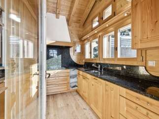 This stunning kitchen boasts a warm, inviting atmosphere with its natural wood cabinetry and flooring.