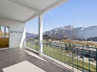 Enjoy breathtaking mountain views from this stunning balcony.