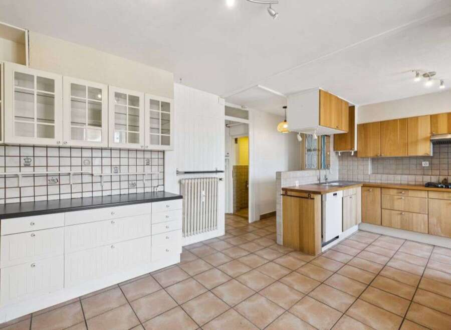 Discover this charming kitchen with ample storage and a bright, airy feel.