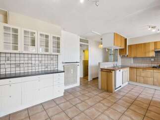 Discover this charming kitchen with ample storage and a bright, airy feel.