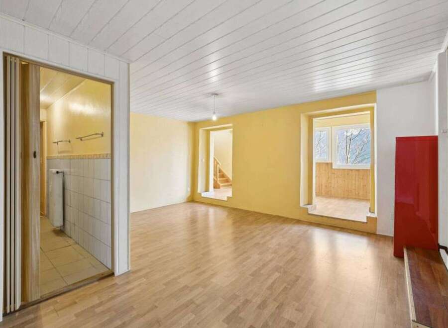 Discover this inviting property featuring a bright and airy interior with hardwood floors.