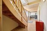 This charming property features a beautifully crafted wooden staircase, adding warmth and character to the interior.