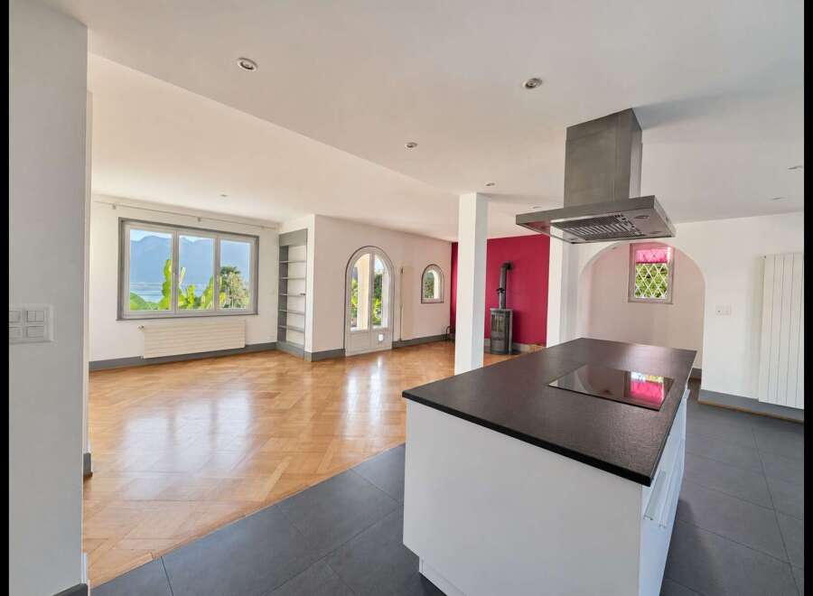 Experience breathtaking lake and mountain views from this stunning open-concept living space.