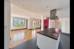 Experience breathtaking lake and mountain views from this stunning open-concept living space.