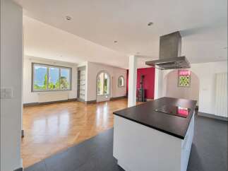 Experience breathtaking lake and mountain views from this stunning open-concept living space.