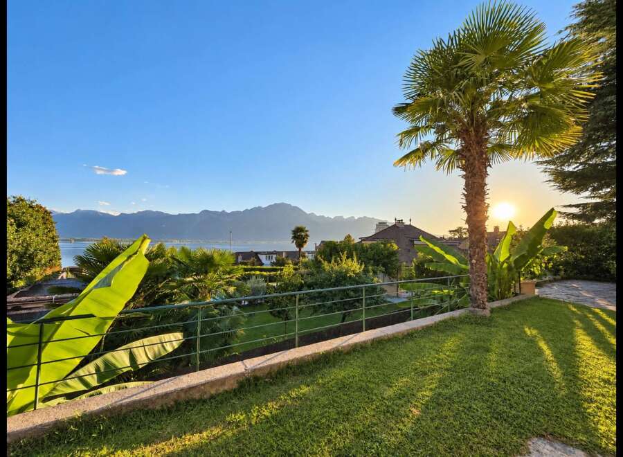 Experience breathtaking sunset views over the lake and mountains from this stunning property.