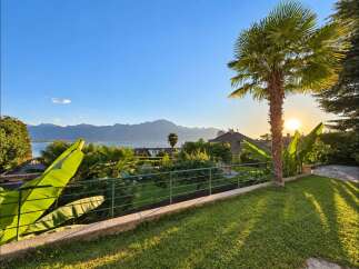 Experience breathtaking sunset views over the lake and mountains from this stunning property.
