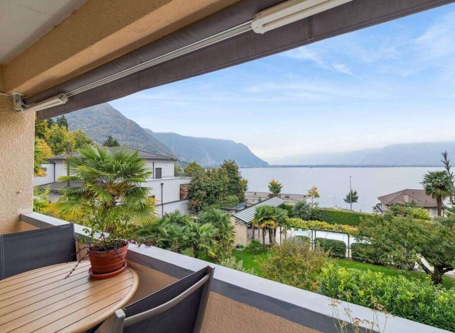 Enjoy breathtaking views from this stunning property! This home features a private balcony overlooking a serene lake and lush greenery.
