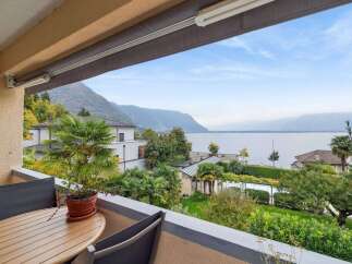 Enjoy breathtaking views from this stunning property! This home features a private balcony overlooking a serene lake and lush greenery.