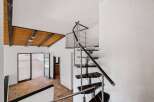 Experience modern living with this stunning spiral staircase, a true architectural statement.