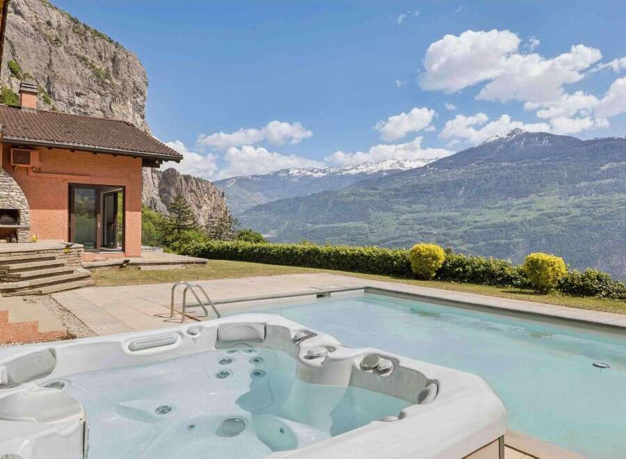 Experience luxury living with this stunning property featuring a private hot tub and swimming pool, perfect for relaxation and entertainment.
