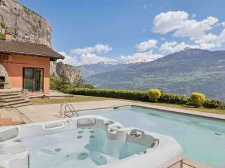 Experience luxury living with this stunning property featuring a private hot tub and swimming pool, perfect for relaxation and entertainment.