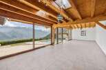Experience breathtaking mountain views from this stunning property, featuring expansive glass walls that seamlessly blend indoor and outdoor living.