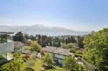 Experience breathtaking views from this stunning property, featuring a modern design and lush landscaping.