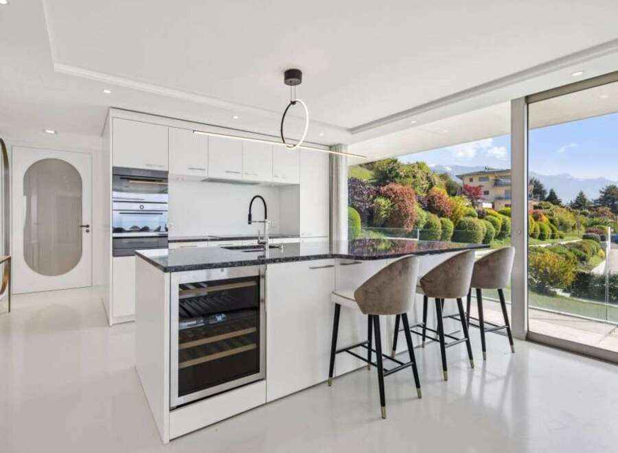 Experience luxury living in this stunning kitchen with a modern design.