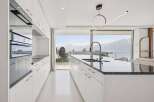 Experience luxury living in this stunning kitchen with breathtaking views.