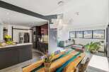 Experience modern luxury in this stunning property featuring a unique epoxy resin dining table, perfect for entertaining.
