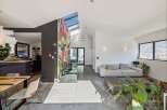Experience modern living in this stunning property featuring a vibrant mural accent wall and sleek, contemporary design.