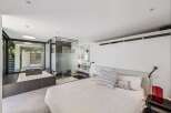 Experience luxury living in this stunning bedroom featuring a modern design and open layout.