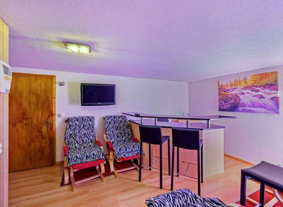 Discover the perfect blend of relaxation and entertainment in this stylish space.