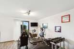 This home gym offers a dedicated space for fitness enthusiasts.