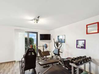 This home gym offers a dedicated space for fitness enthusiasts.