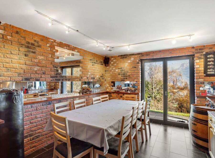 Step into this unique dining space, featuring exposed brick walls and a stylish, modern design.