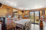 Step into this unique dining space, featuring exposed brick walls and a stylish, modern design.