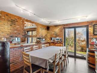 Step into this unique dining space, featuring exposed brick walls and a stylish, modern design.