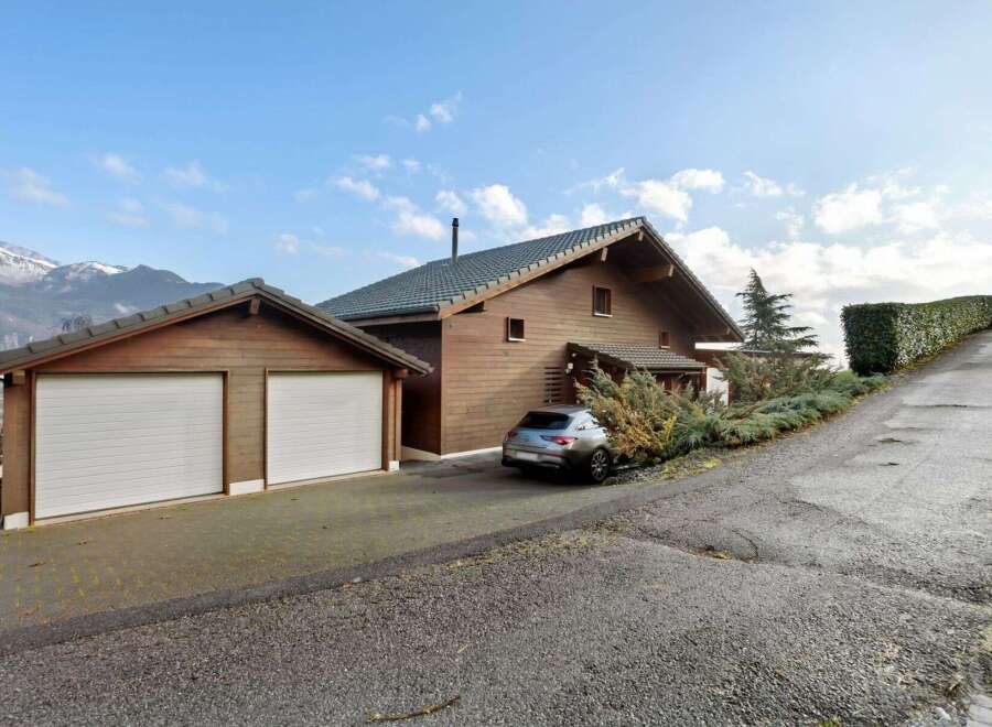 Discover this stunning property featuring a beautiful wooden house with a two-car garage.