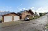 Discover this stunning property featuring a beautiful wooden house with a two-car garage.