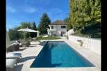 Discover luxury living in this stunning property featuring a private pool and lush landscaping.