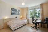 This cozy bedroom offers a comfortable and inviting atmosphere, perfect for relaxation and productivity.