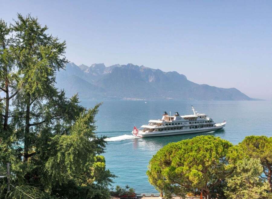 Enjoy breathtaking views of the lake and mountains from this stunning property.