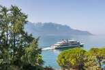 Enjoy breathtaking views of the lake and mountains from this stunning property.