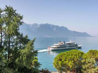 Enjoy breathtaking views of the lake and mountains from this stunning property.