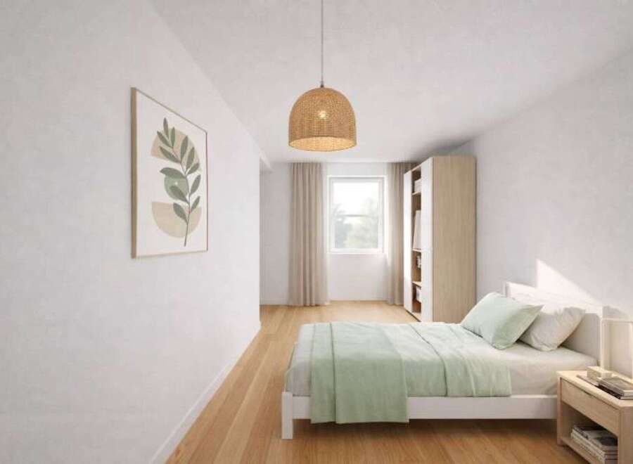 This inviting bedroom features a minimalist design with a touch of nature-inspired decor.