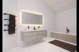 This modern bathroom boasts a sleek design with a floating vanity and a large illuminated mirror.