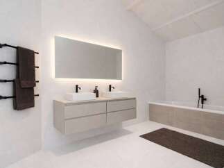 This modern bathroom boasts a sleek design with a floating vanity and a large illuminated mirror.
