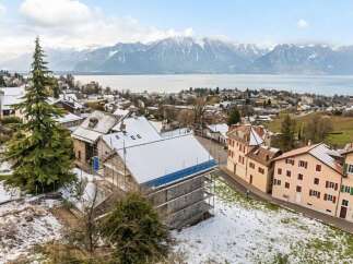 Discover this charming property nestled in a picturesque village with stunning mountain and lake views.