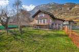 Nestled against a stunning mountain backdrop, this charming property offers a serene living experience.