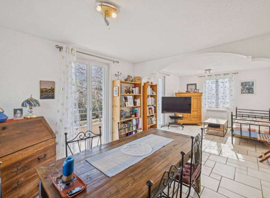Discover the charm of this inviting property, featuring a spacious dining area perfect for gatherings.