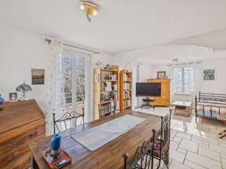 Discover the charm of this inviting property, featuring a spacious dining area perfect for gatherings.