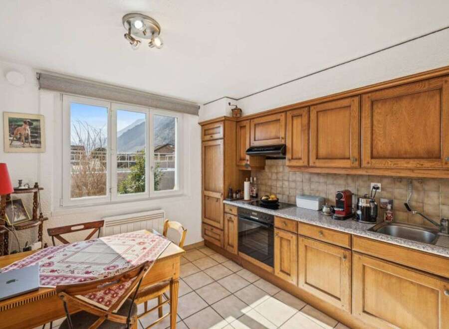 This charming kitchen offers a warm and inviting atmosphere, perfect for culinary adventures.
