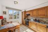This charming kitchen offers a warm and inviting atmosphere, perfect for culinary adventures.