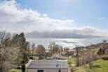 Enjoy breathtaking views from this stunning property! This home offers a serene escape with panoramic vistas of the lake and majestic mountains.