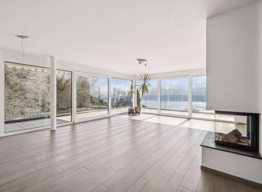Experience luxury living in this stunning property with expansive windows offering breathtaking views.