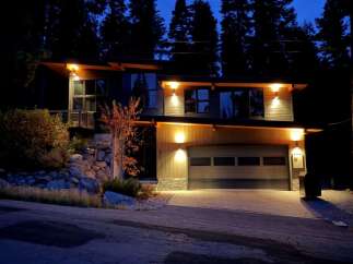 This stunning modern home offers a luxurious living experience with its sleek design and inviting ambiance.
